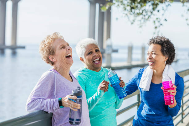 istock Three mature and senior women exercising on waterfront 950962116
