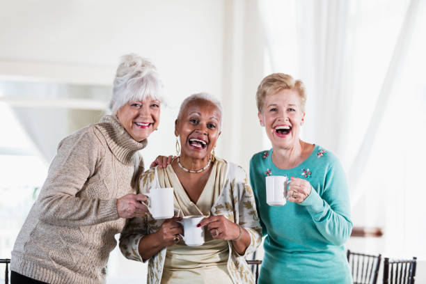 istock Three multi-ethnic senior women socializing over coffee 950964756