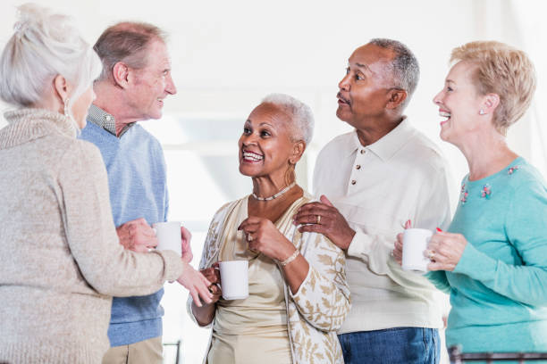 istock Group of seniors socializing over coffee 950965172
