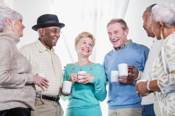 istock Group of seniors socializing over coffee 950965224