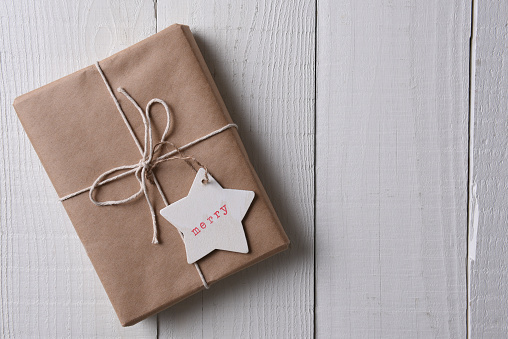 Christmas Present Wrapped With Plain Brown Paper Stock Photo - Download  Image Now - Christmas, Christmas Present, Copy Space - iStock