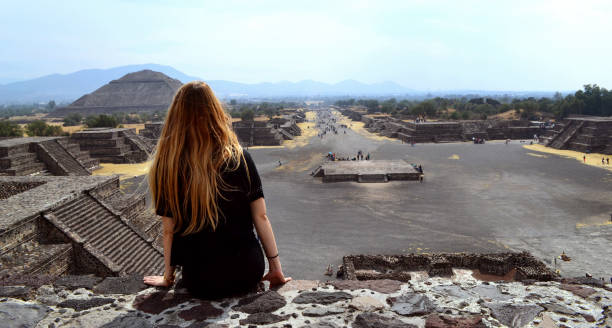istock Girl in front of mayan pyramids 950969036