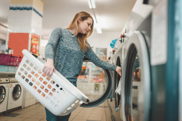 istock Young woman having a laundry day 950969612