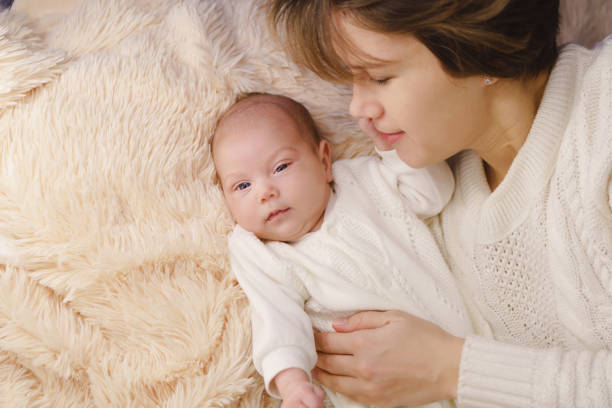 istock Mother and newborn daughter 950970144