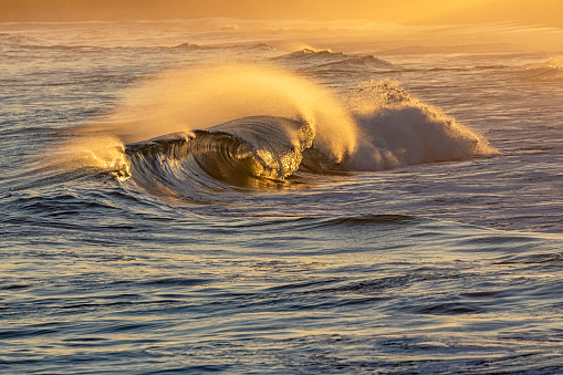Big waves on the sea at sunset. Beautiful seascape. The sea is stormy.