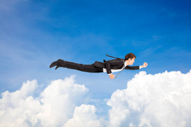 business man flying above the cloud business man flying above the cloud jump jet stock pictures, royalty-free photos & images