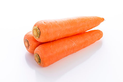 fresh carrots on black back