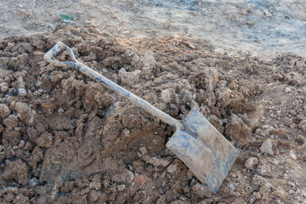 istock Pile of dirt, soil and shovel. Construction, digging scene 950977580