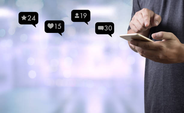 istock Contact us  sms media man use  smart phone social media network pop notification icons 950979364