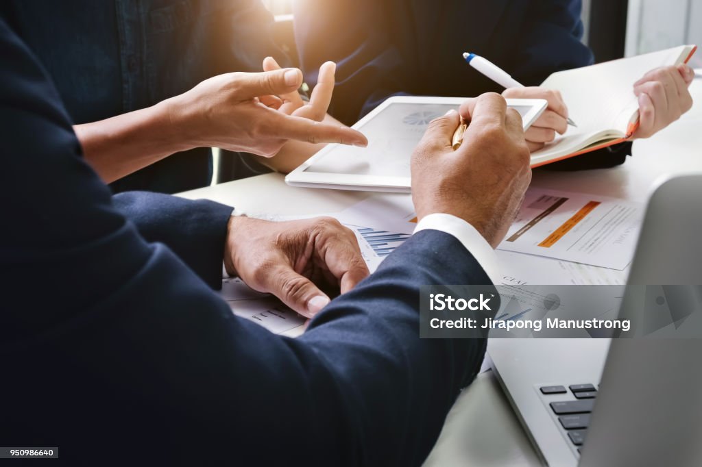 Business Finance, accounting, contract, advisor investment consulting marketing plan for the company with using tablet and computer technology in analysis. Advice Stock Photo