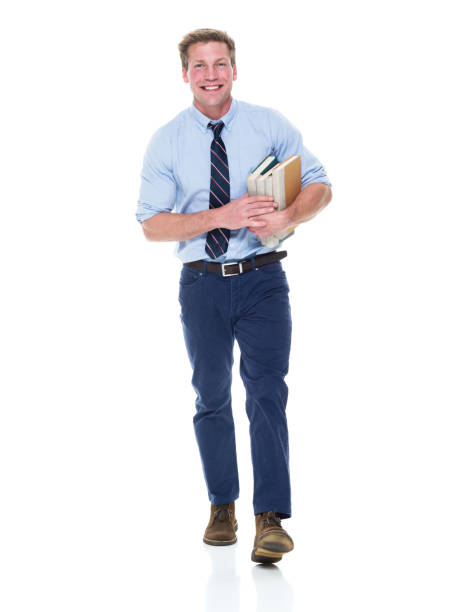 istock Handsome well dressed man is holding books 950986832