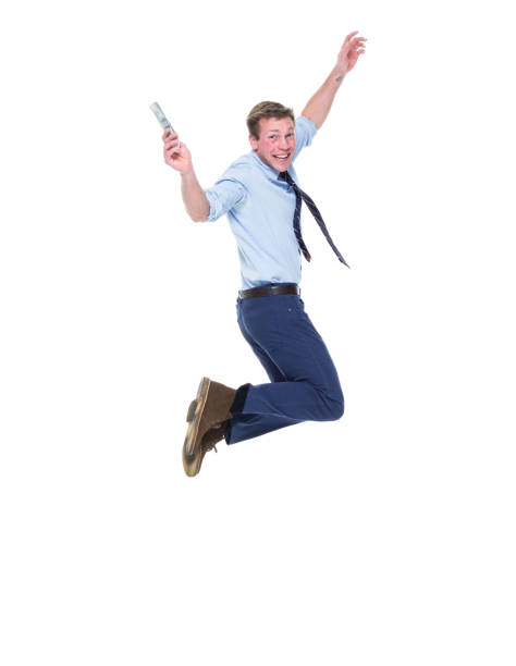 istock Handsome well dressed man jumping with money 950986904
