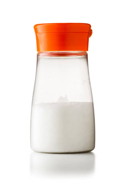 A plastic shaker of MSG (monosodium glutamate) flavour enhancer isolated on white background with clipping path