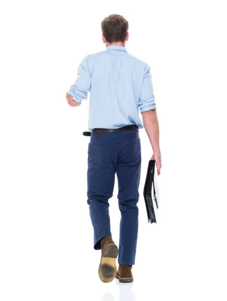 istock Handsome well dressed man holding coffee and briefcase 950987904
