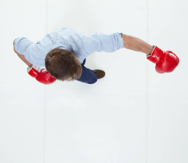 istock Beautiful businessman is boxing 950991218