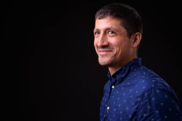 istock Portrait Of Happy Hispanic Man Smiling 950991584