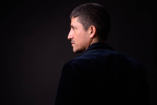 Portrait Of Hispanic Man Against Black Background