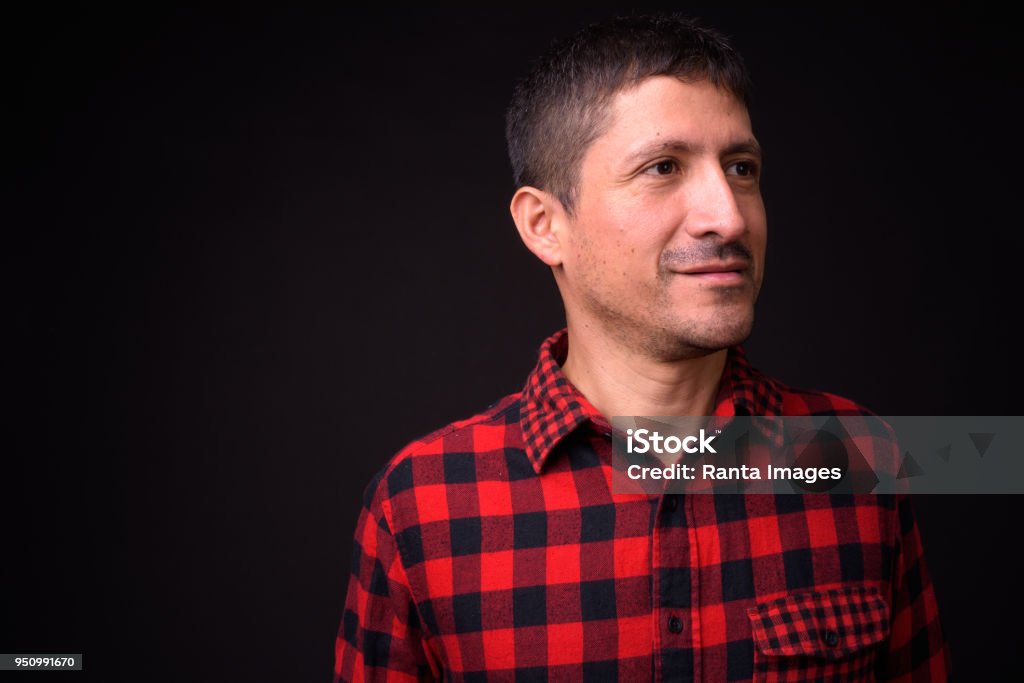 Portrait Of Hispanic Man Portrait Of Hispanic Man Against Black Background 35-39 Years Stock Photo