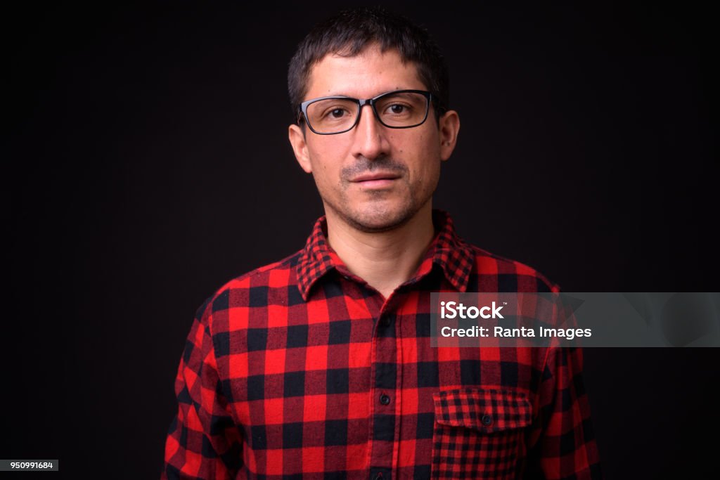 Portrait Of Hispanic Man Portrait Of Hispanic Man Against Black Background 35-39 Years Stock Photo