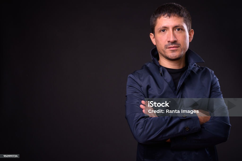 Portrait Of Hispanic Man Portrait Of Hispanic Man Against Black Background 40-44 Years Stock Photo