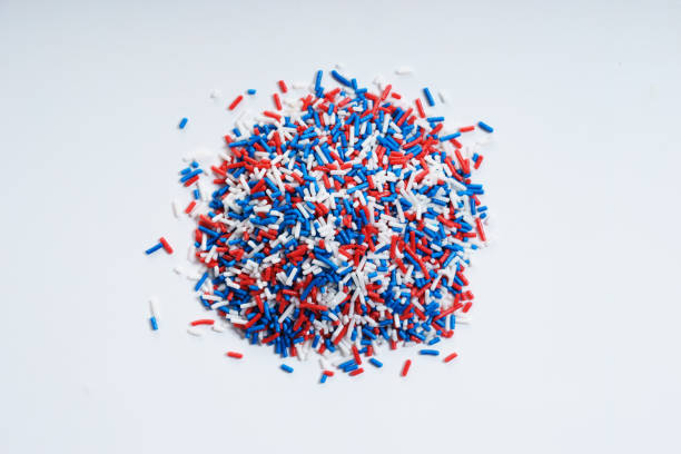 istock Sugar sprinkle dots in blue, white and red colors 950994842
