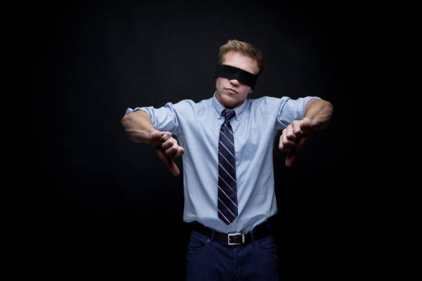 istock Handsome young male thumbs down 950995842