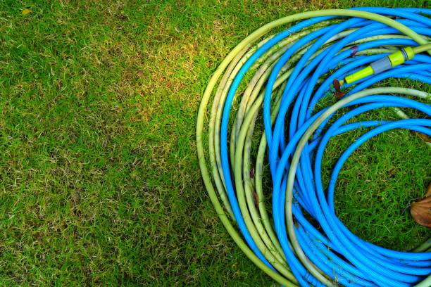 istock Closed-up Garden Hose on Grass. 950997018