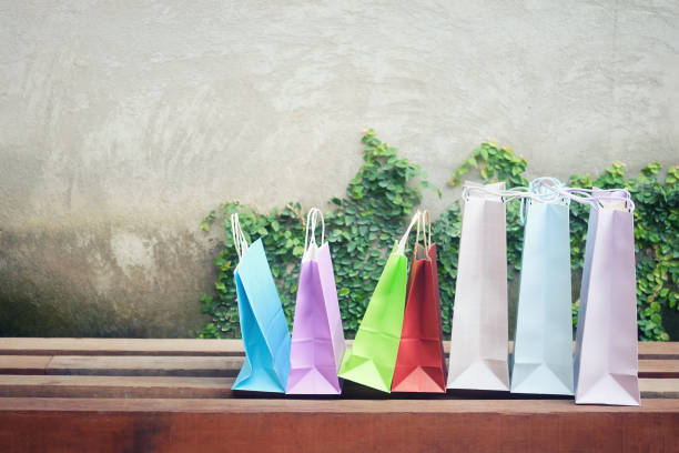 istock pattern shopping bag on wood chair with shopping concept. 950997074
