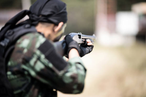 istock Special forces soldier  or private millitary holding gun aiming. 950999710