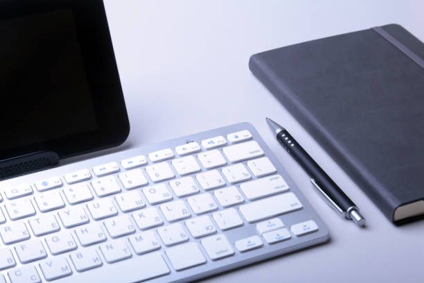istock Corporate business desktop with laptop, digital tablet, accessories and work equipment. selective focus. 951000950