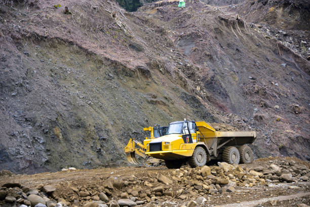 istock Heavy articulated dump truck work at a huge dam construction site 951001458