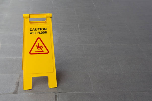 istock yellow wet sign floor on floor 951004942