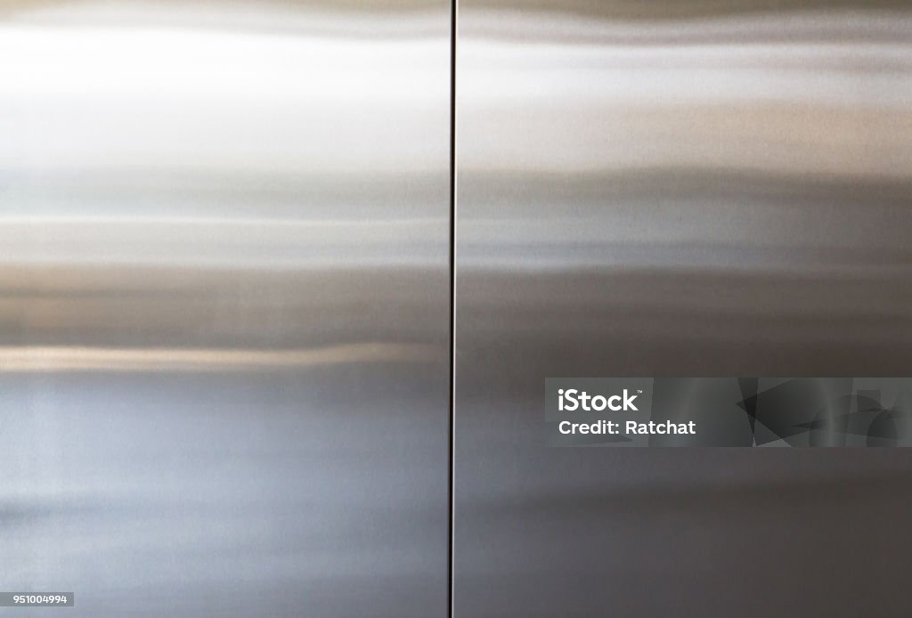 stainless steel elevator door background and texture, silver metal wall panel Chrome Stock Photo