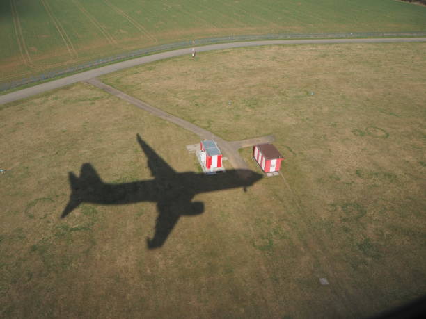 istock Shadow of the plane in the fields during the landing 951007340