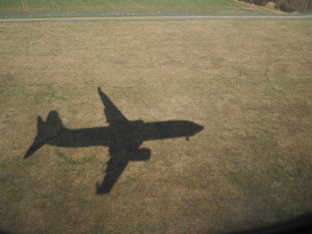 istock Shadow of the plane in the fields during the landing 951007356