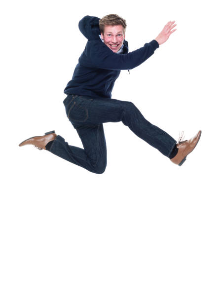istock Attractive young male jumping 951007876