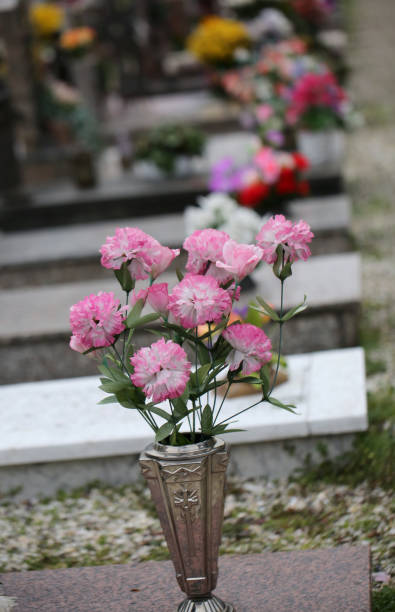 istock colorful flowers resting on a grave 951010682