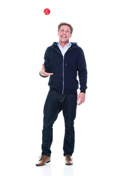 istock Attractive young male holding an apple 951010966