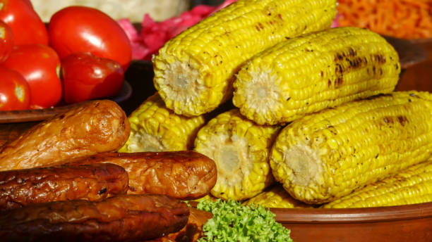 istock Grilled sausages with baked corn 951013652