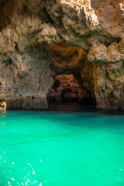 istock Lagos Caves and Seashore with its Esmerald Water 951013980