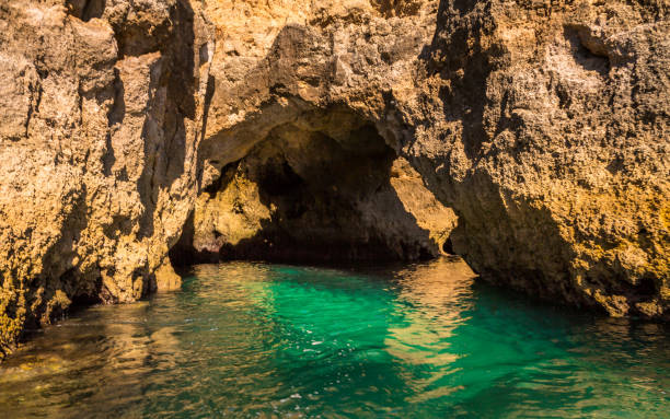 istock Lagos Caves and Seashore with its Esmerald Water 951014348