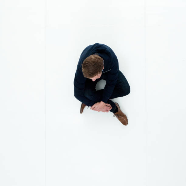 istock Man in hooded jacket sitting 951018618