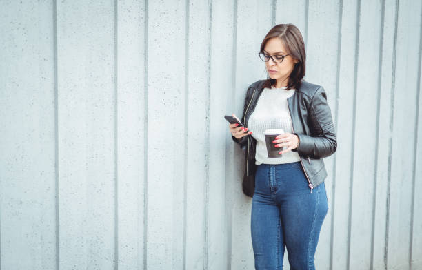 istock Young woman with mobile phone 951021618