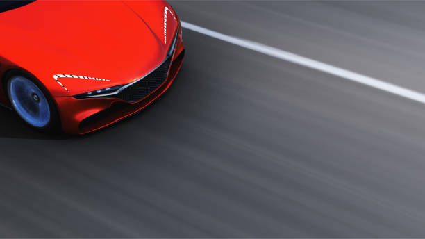 istock red car driving on a road 951022282