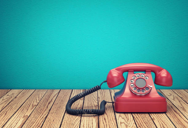 istock Red rotary telephone on wood table 951022342