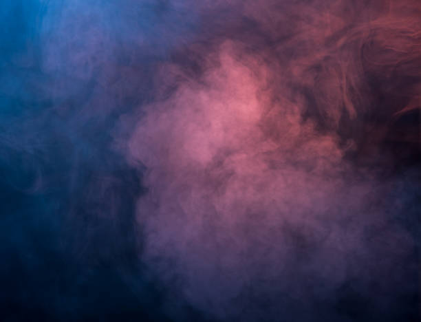 istock Abstract blue and pink smoke on a dark background 951022674