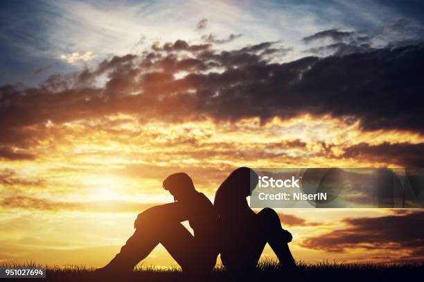 Sad Couple Sitting Backtoback On A Ground Stock Photo - Download Image Now - Couple - Relationship, Relationship Breakup, Sadness