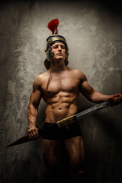 istock Muscular male warrior posing showing his body 951029758