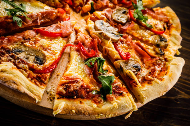 istock Pizza margherita with arugula on wooden background 951033416