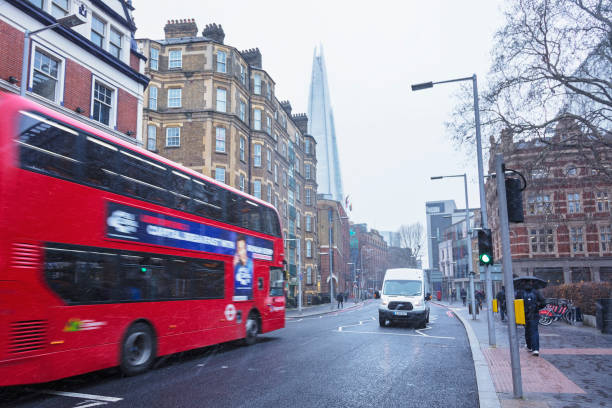 London, United Kingdom - February 26, 2018: A daytime snowstorm deluges people, traffic and public transport, London, UK